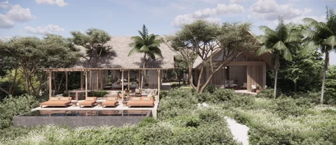 Villa with open patio, relaxation seating by a small pool, embraced by native greenery and tall trees beneath a partially cloudy daytime sky.