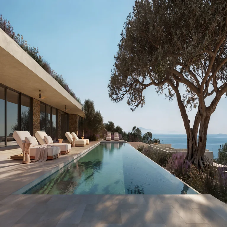 Sustainable design with a tranquil pool, shaded seating, and native tree bordering the ocean under a bright sky, reflecting wellness values and unobstructed natural views.
