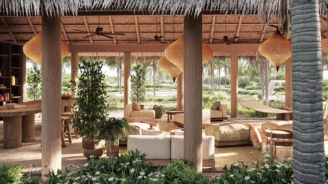 Lounge area featuring natural wood furnishings, comfortable seating, woven lighting, abundant greenery and hammock, set against tropical garden views with palm trees.
